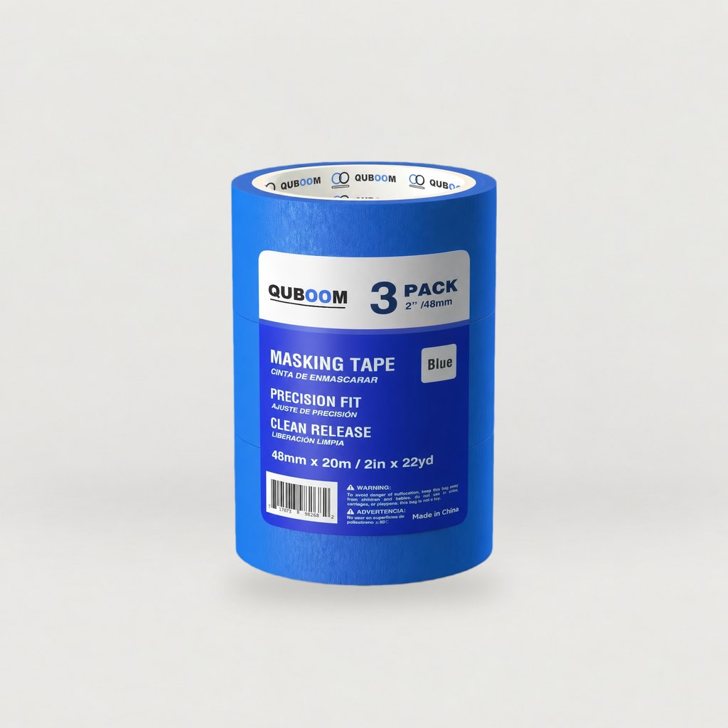 Quboom blue painter's tape 3-pack, 2 in × 22 yd, on a grey studio sweep