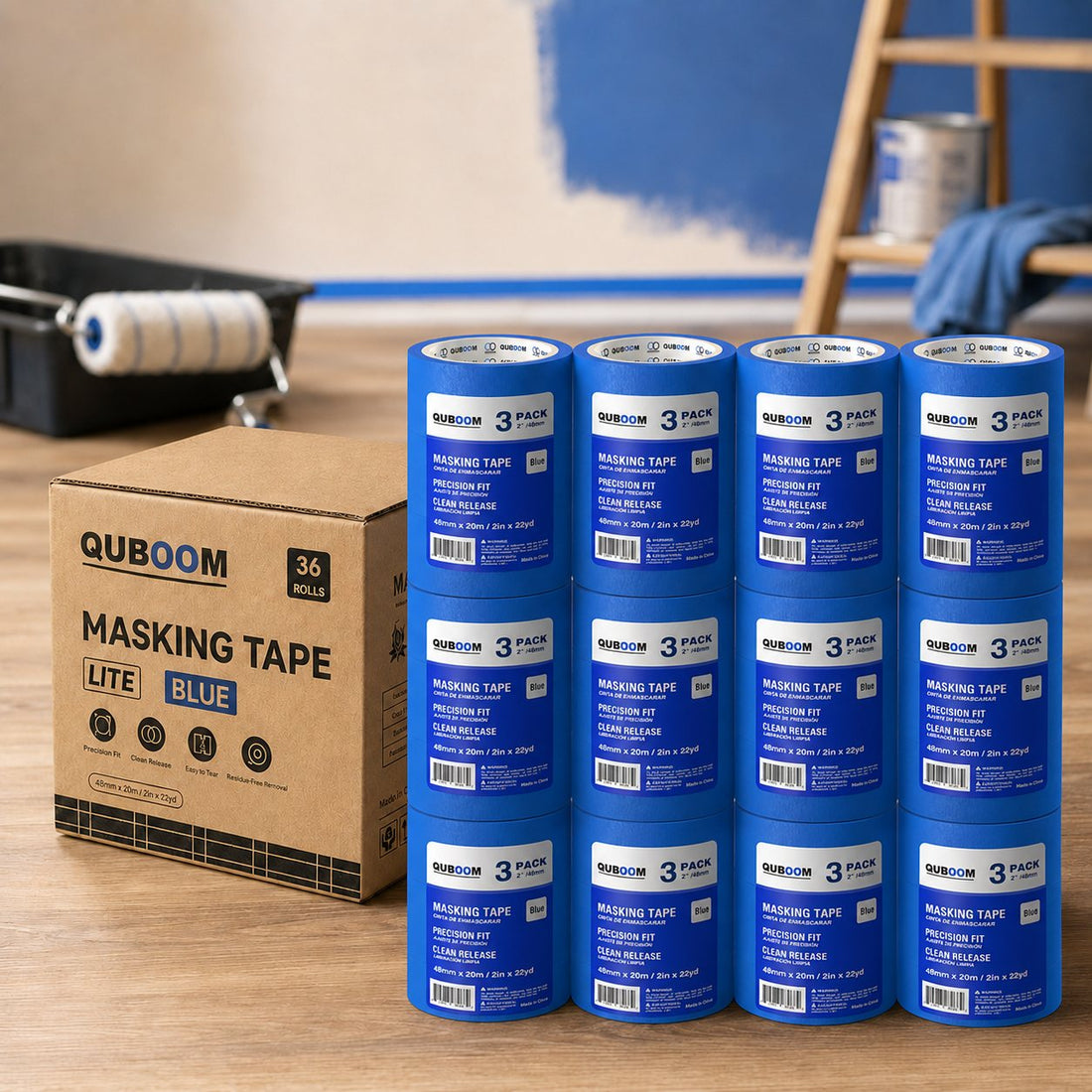 Twelve 3-packs of Quboom tape stacked beside a 36-roll shipping case