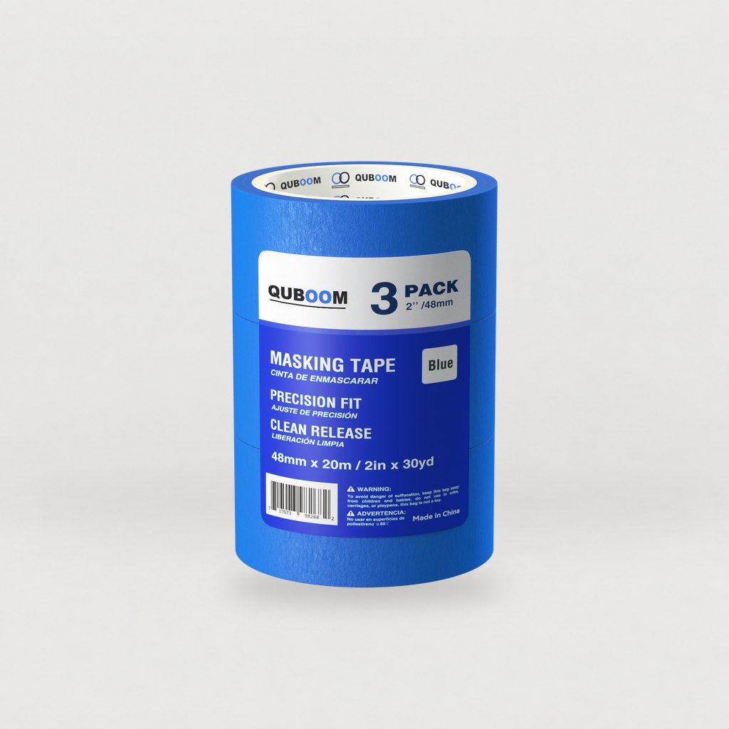 Quboom blue painter's tape 3-pack, 2 in × 30 yd, on a grey studio sweep